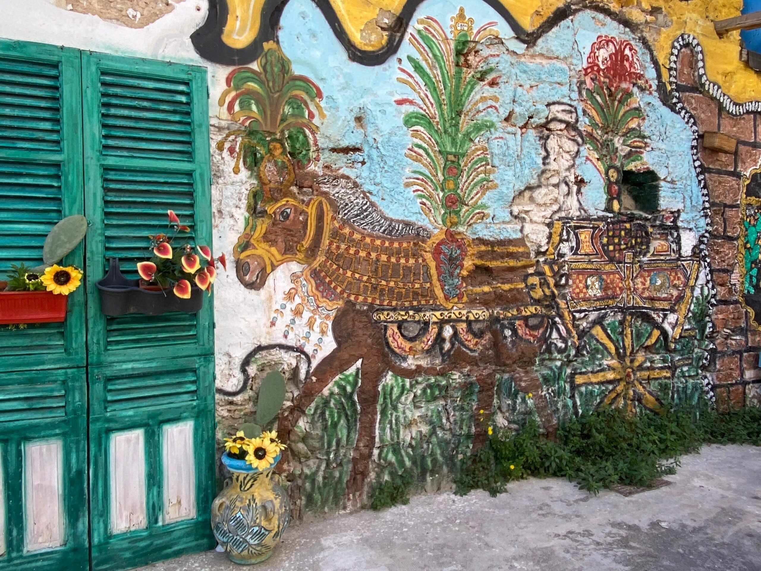 687fe3f23d5881a51c1dcad0-scaled-2 Ein Wandgemälde in Palermo, Italien.